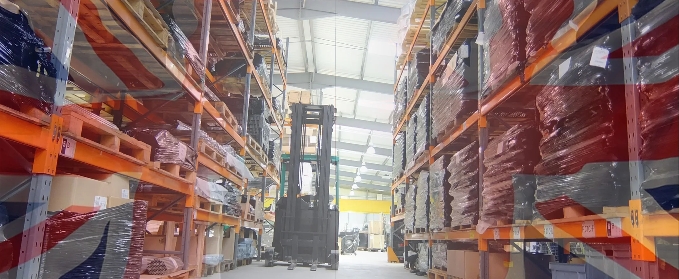 Made in Britain – Why UK Manufacturing Still Wins Warehouse with a forklift and British flag